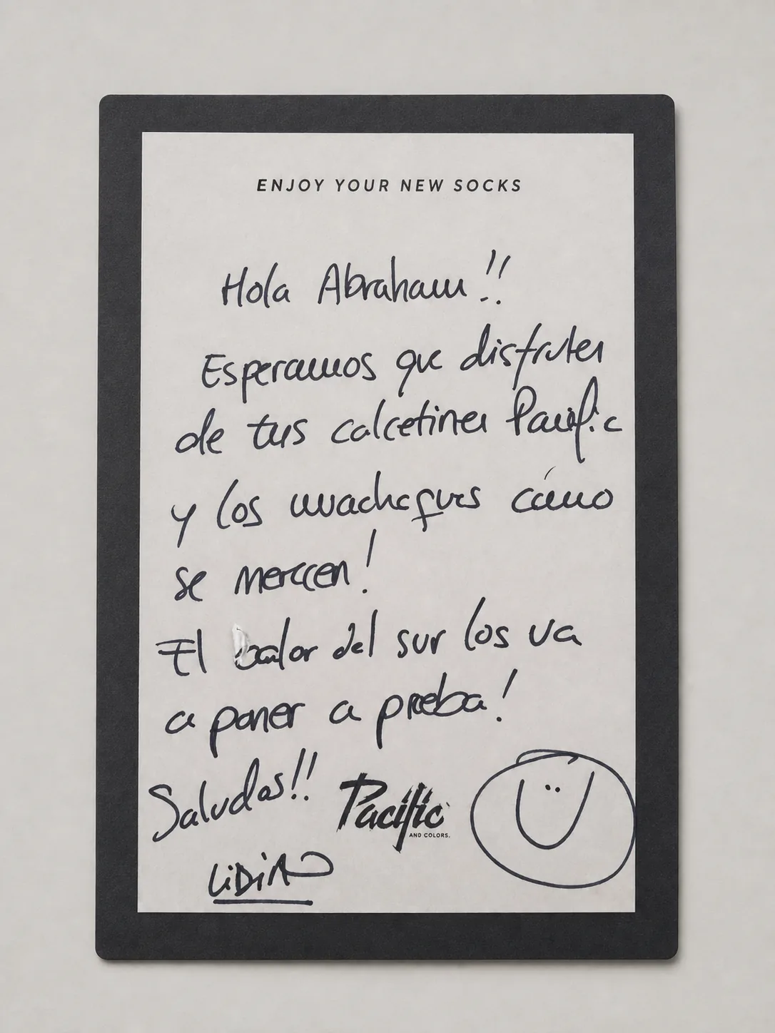 Nota manuscrita de Pacific & Co. dirigida a Abraham con el encabezado Enjoy Your New Socks