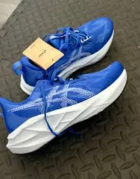 Women running on pavement showing running shoes in action