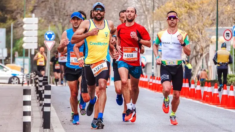 Marathon runners racing on a city road