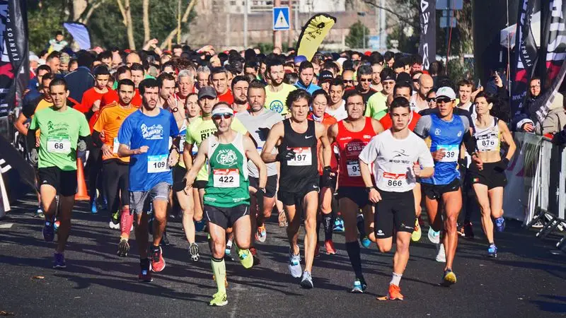 Group of adult runners participating in a popular race