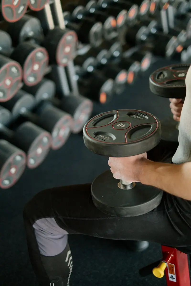 Runner performing squat exercise in the gym
