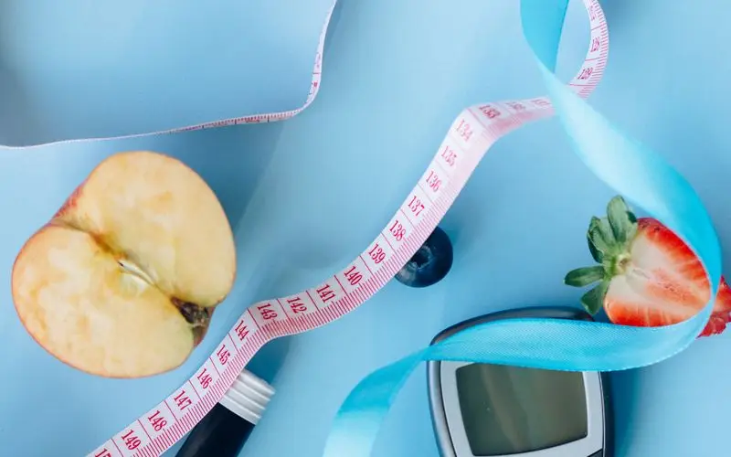 Person with diabetes monitoring glucose before running